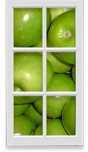 Window into a pile of green apples